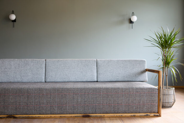 Scandinavian sustainable furniture design. Sleek, simple and elegant sofa made with repurposed oak and upholstered with Icelandic wool tweed. Bespoke item made to custom order.