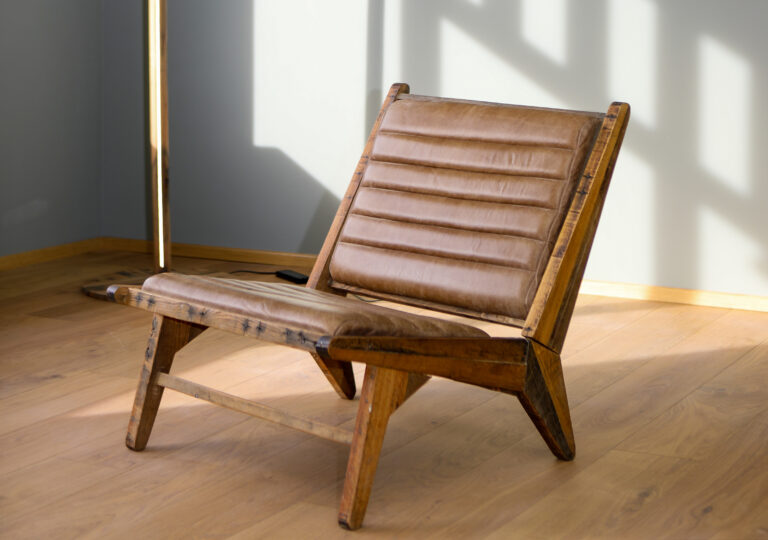 Lounge chair made from repurposed shipping pallets and upcycled leather. Icelandic design